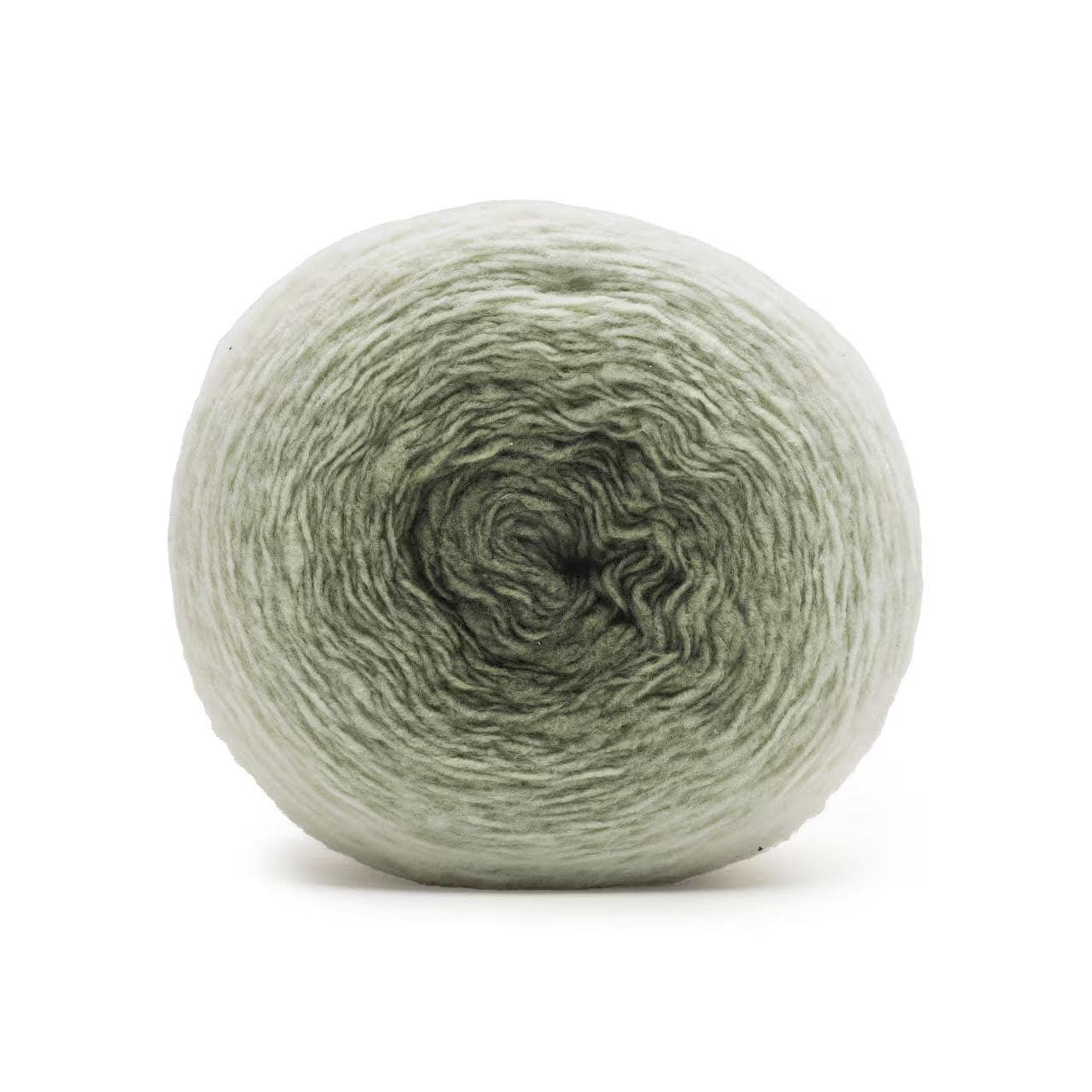 A large ball of yarn, transitioning from white to light green to dark green, sits on a white background.