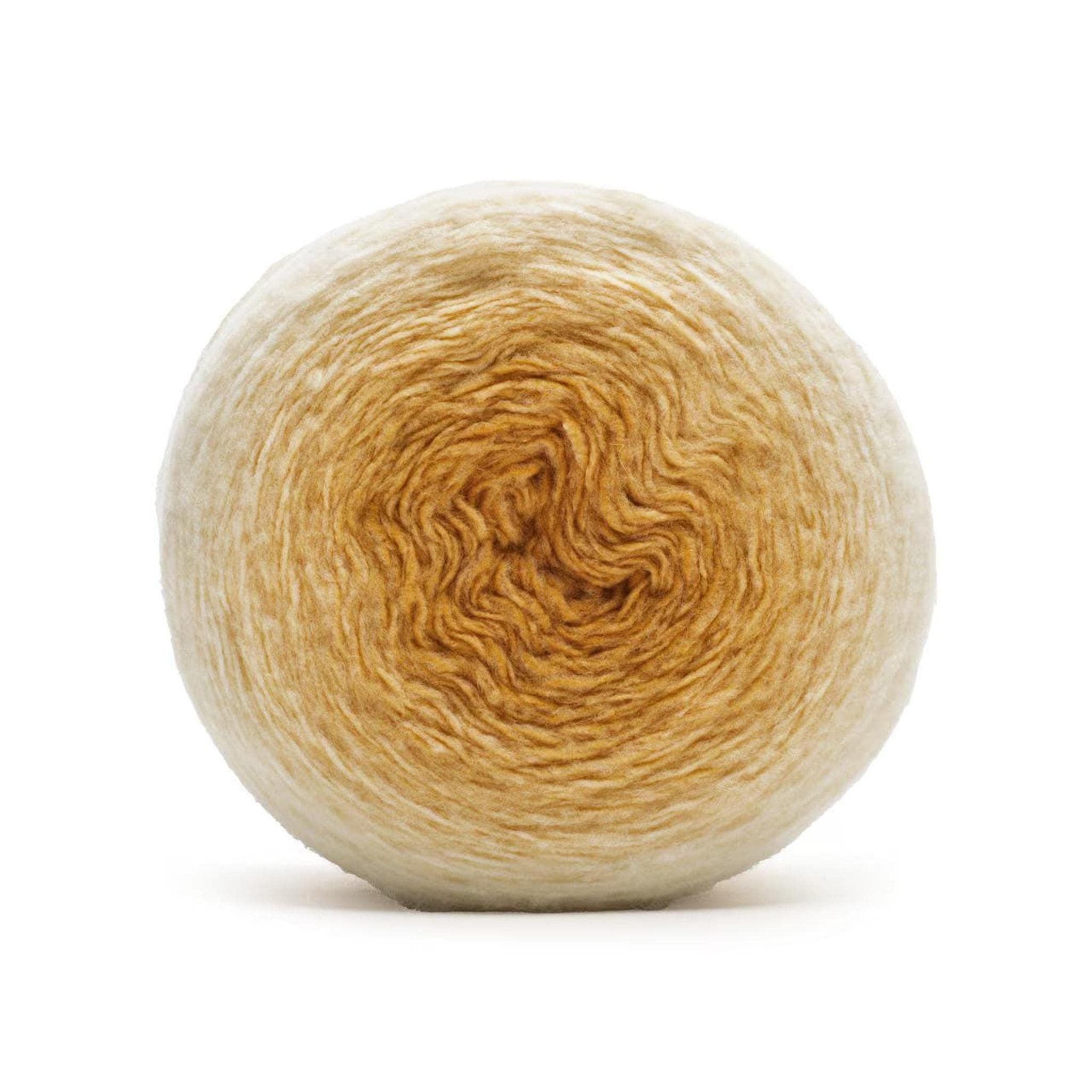 A ball of yarn with a gradient from cream on the outside to golden brown in the center.