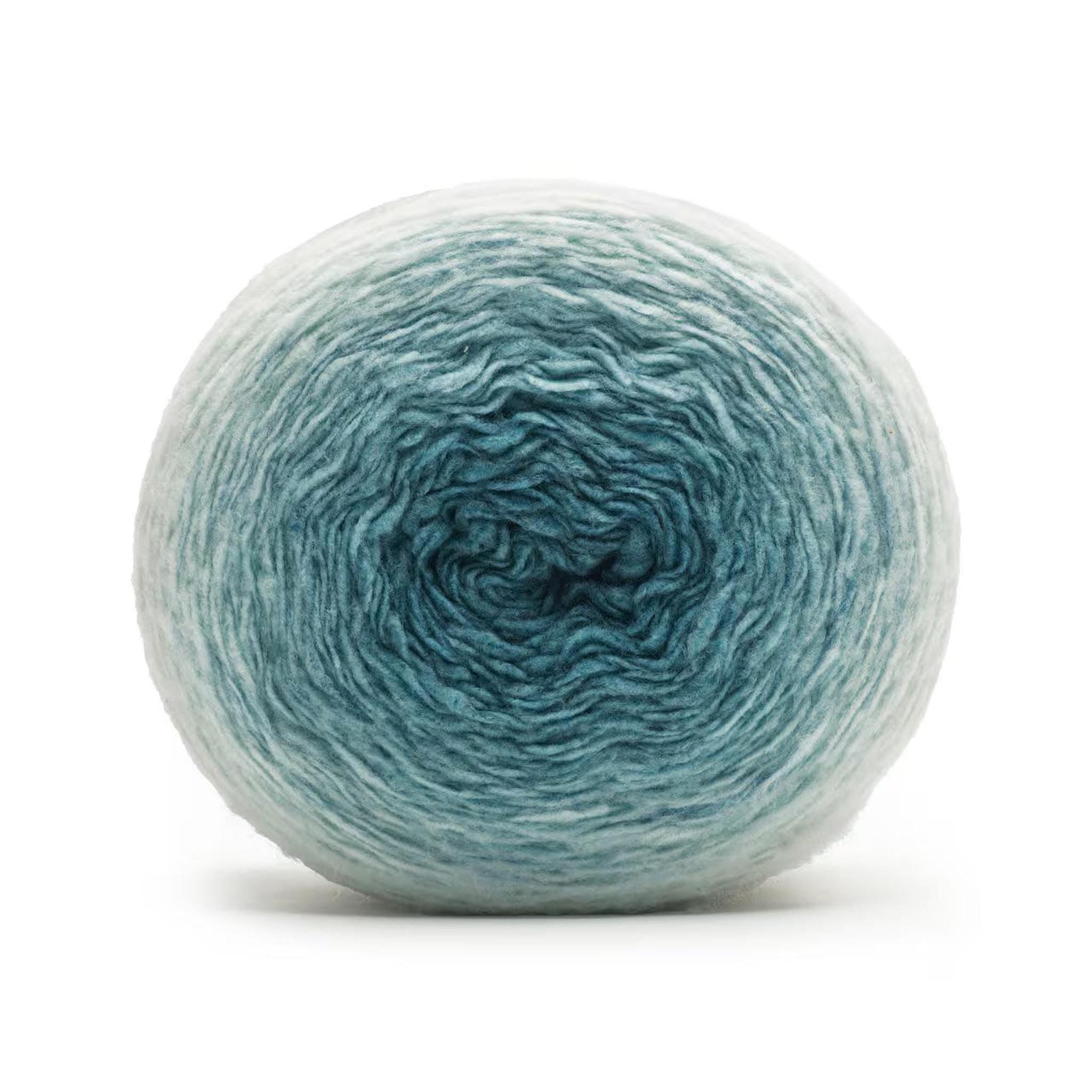 A ball of yarn with a gradient from light blue on the outside to teal in the center.