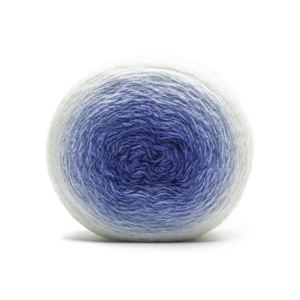 A ball of yarn with a gradient from light blue on the outside to deep blue in the center.