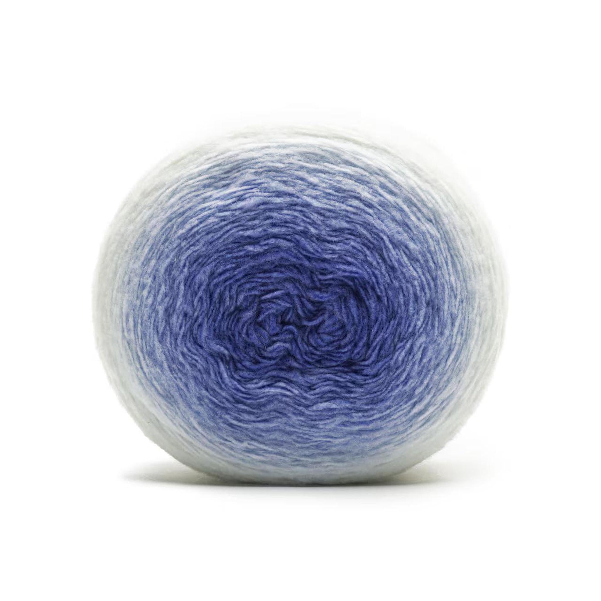 A ball of yarn with a gradient from light blue on the outside to deep blue in the center.